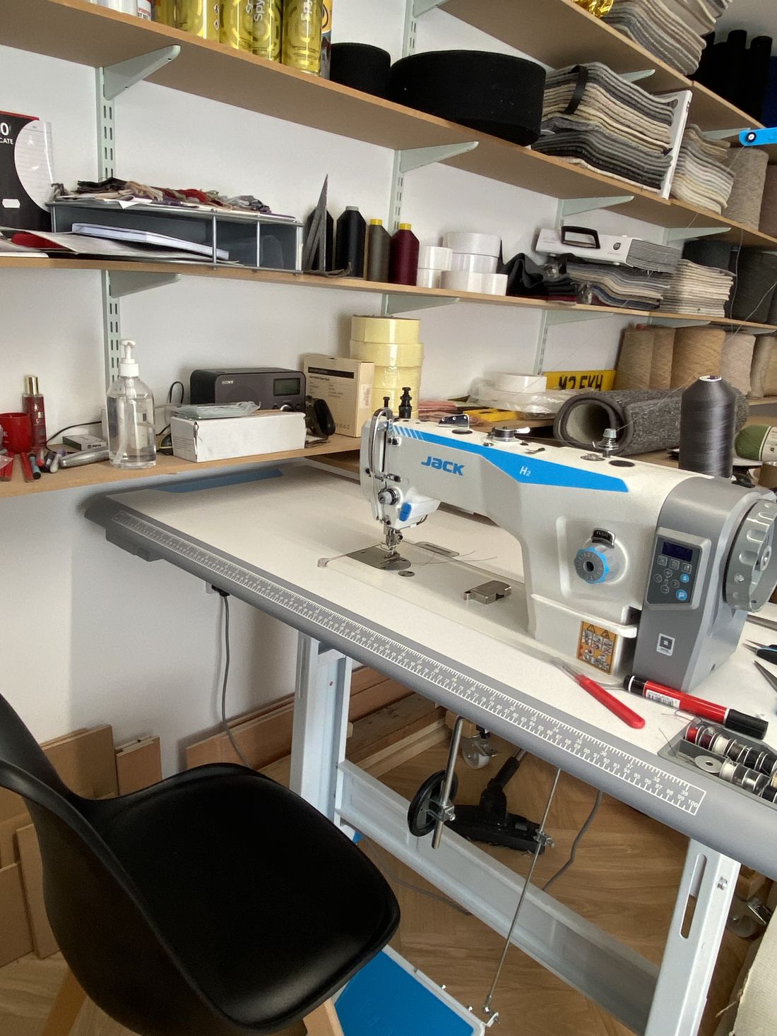 The tape edging machine set up on the bench in the Melksham studio