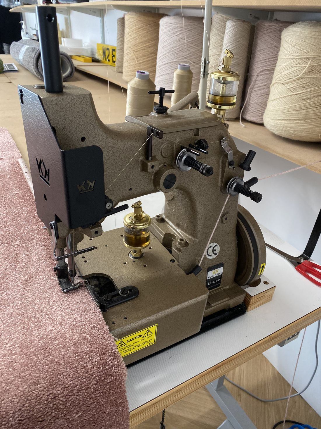 The whipping machine in the Melksham studio, working along the edge of a carpet